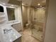 Beautiful bathroom featuring marble counters, a glass-enclosed shower, and modern fixtures at 3047 Lenox Ne Rd # 2105, Atlanta, GA 30324