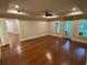Inviting bedroom with hardwood floors, ceiling fan, and access to the outdoors at 3047 Lenox Ne Rd # 2105, Atlanta, GA 30324