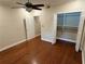 Well-lit bedroom with hardwood floors, a ceiling fan, and closet at 3047 Lenox Ne Rd # 2105, Atlanta, GA 30324