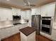 Modern kitchen featuring white cabinets, stainless steel appliances and a center island at 3047 Lenox Ne Rd # 2105, Atlanta, GA 30324