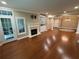 Spacious living room with a fireplace, built-in shelving, and access to a balcony at 3047 Lenox Ne Rd # 2105, Atlanta, GA 30324