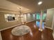 Open-concept living room with hardwood floors and natural light flowing in through the windows at 3047 Lenox Ne Rd # 2105, Atlanta, GA 30324