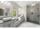 Elegant bathroom featuring a glass shower, and dual sinks with granite countertops at 727 Hammond Dr, Woodstock, GA 30188