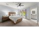 Bedroom with light blue walls, ceiling fan, and natural light coming through the windows at 727 Hammond Dr, Woodstock, GA 30188