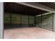 A well-maintained carport with a horizontal slat design for covered parking at 727 Hammond Dr, Woodstock, GA 30188