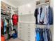 Organized walk-in closet with custom shelving, drawers, and hanging rods for ample storage at 727 Hammond Dr, Woodstock, GA 30188