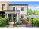 Charming home featuring a manicured front yard, covered porch with columns and an American flag at 727 Hammond Dr, Woodstock, GA 30188