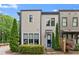 Charming two-story townhome with manicured landscaping and a modern design at 727 Hammond Dr, Woodstock, GA 30188