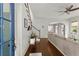 Bright foyer with hardwood floors, stairs, and an open view into the spacious living area at 727 Hammond Dr, Woodstock, GA 30188
