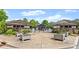 Elegant gated entrance to the community pool with decorative planters and stone structures at 727 Hammond Dr, Woodstock, GA 30188