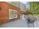 Relax on this back deck with outdoor seating, white railings, and brick exterior at 8640 Amsbury Way, Cumming, GA 30041