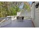 Spacious back deck with outdoor seating and white railings offering a peaceful retreat at 8640 Amsbury Way, Cumming, GA 30041