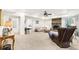 Finished basement with a stone fireplace, a seating area, and neutral carpeting at 8640 Amsbury Way, Cumming, GA 30041
