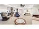 Spacious basement with stone pillars, a game area, and neutral carpet at 8640 Amsbury Way, Cumming, GA 30041