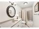 Well-lit bathroom featuring a large vanity, a tub, and neutral colors at 8640 Amsbury Way, Cumming, GA 30041