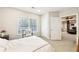 Inviting bedroom with a glimpse into the living room at 8640 Amsbury Way, Cumming, GA 30041