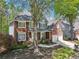 Beautiful two-story brick home with a well-manicured lawn and a two car garage at 8640 Amsbury Way, Cumming, GA 30041