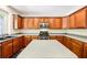 Well-lit kitchen with stainless steel appliances, modern microwave, and gray countertops at 8640 Amsbury Way, Cumming, GA 30041