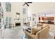 Bright, open living room with high ceilings, fireplace, and seamless access to the kitchen at 8640 Amsbury Way, Cumming, GA 30041