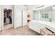 Open primary bathroom featuring double doors, tile floor, and walk in closet at 8640 Amsbury Way, Cumming, GA 30041