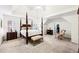Spacious main bedroom featuring high ceilings, windows, and sitting area with carpet flooring at 8640 Amsbury Way, Cumming, GA 30041