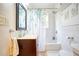Cozy bathroom featuring tiled shower, vanity with sink, and decorative shower curtain at 98 Chappell Nw Rd, Atlanta, GA 30314