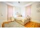 Bedroom featuring hardwood floors, natural light, bed with decorative metal frame at 98 Chappell Nw Rd, Atlanta, GA 30314