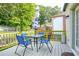 Outdoor deck with table, umbrella, chairs, and green railing offering great space for entertainment at 98 Chappell Nw Rd, Atlanta, GA 30314