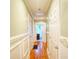 Hallway featuring hardwood floors and white trim, leading to bathroom at 98 Chappell Nw Rd, Atlanta, GA 30314