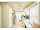 Bright kitchen with white cabinets, stainless steel appliances, and a view to the backyard at 98 Chappell Nw Rd, Atlanta, GA 30314
