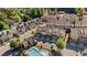 Aerial view of a residential community, showcasing townhomes, a pool, and lush landscaping, highlighting the neighborhood's amenities at 2166 Sonoma Se Dr, Smyrna, GA 30080