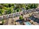 Aerial view of townhomes, showcasing the community, parking, and pool area at 2166 Sonoma Se Dr, Smyrna, GA 30080
