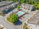 Aerial view featuring a community pool, surrounding townhomes, and convenient parking areas at 2166 Sonoma Se Dr, Smyrna, GA 30080