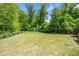 A spacious green backyard offering a private outdoor space for recreation and relaxation at 2166 Sonoma Se Dr, Smyrna, GA 30080