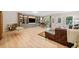 Spacious basement featuring hardwood floors, a built-in entertainment center and ample seating with lots of natural light at 2166 Sonoma Se Dr, Smyrna, GA 30080