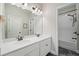 Stylish bathroom featuring a double sink vanity, bright lighting, and bathtub at 2166 Sonoma Se Dr, Smyrna, GA 30080