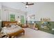 Bright bedroom featuring a comfortable bed, natural light, and neutral decor at 2166 Sonoma Se Dr, Smyrna, GA 30080