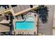 Aerial view of the community pool, showing its layout, surrounding lounge area, and adjacent parking at 2166 Sonoma Se Dr, Smyrna, GA 30080