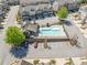 Aerial view of the community pool with parking and surrounding townhome neighborhood at 2166 Sonoma Se Dr, Smyrna, GA 30080