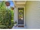Inviting entryway with a decorative wreath, potted plants, and hanging flower baskets, creating a warm and welcoming ambiance at 2166 Sonoma Se Dr, Smyrna, GA 30080