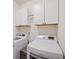 Laundry area featuring a washing machine and dryer with upper cabinets at 2166 Sonoma Se Dr, Smyrna, GA 30080