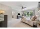 Spacious main bedroom with a large window, a ceiling fan, and an ensuite bathroom at 2166 Sonoma Se Dr, Smyrna, GA 30080