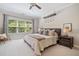 Main bedroom with a statement light fixture, a sitting area and a large window at 2166 Sonoma Se Dr, Smyrna, GA 30080
