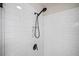 Detail of the shower featuring white subway tile and rainfall shower head at 2166 Sonoma Se Dr, Smyrna, GA 30080