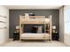 Bright bedroom showcasing a bunk bed with ladder, accompanied by baseball bats and decorative pillows at 2429 Livi Ln, Buford, GA 30519