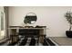 Stylish dining area with modern decor, including a sleek table, chairs, and decorative accessories at 2429 Livi Ln, Buford, GA 30519