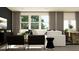 Modern living room with comfortable seating, stylish decor, and plenty of natural light at 2429 Livi Ln, Buford, GA 30519