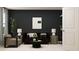 Comfortable living room with dark accent wall, modern furniture, and a cozy brown sofa at 2429 Livi Ln, Buford, GA 30519