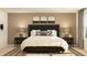 Stylishly furnished bedroom with a dark upholstered headboard and decorative pillows at 2429 Livi Ln, Buford, GA 30519