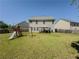 Spacious backyard featuring a playset, a swing, and a gazebo on a sunny day at 2775 Storybook Ct, Grayson, GA 30017